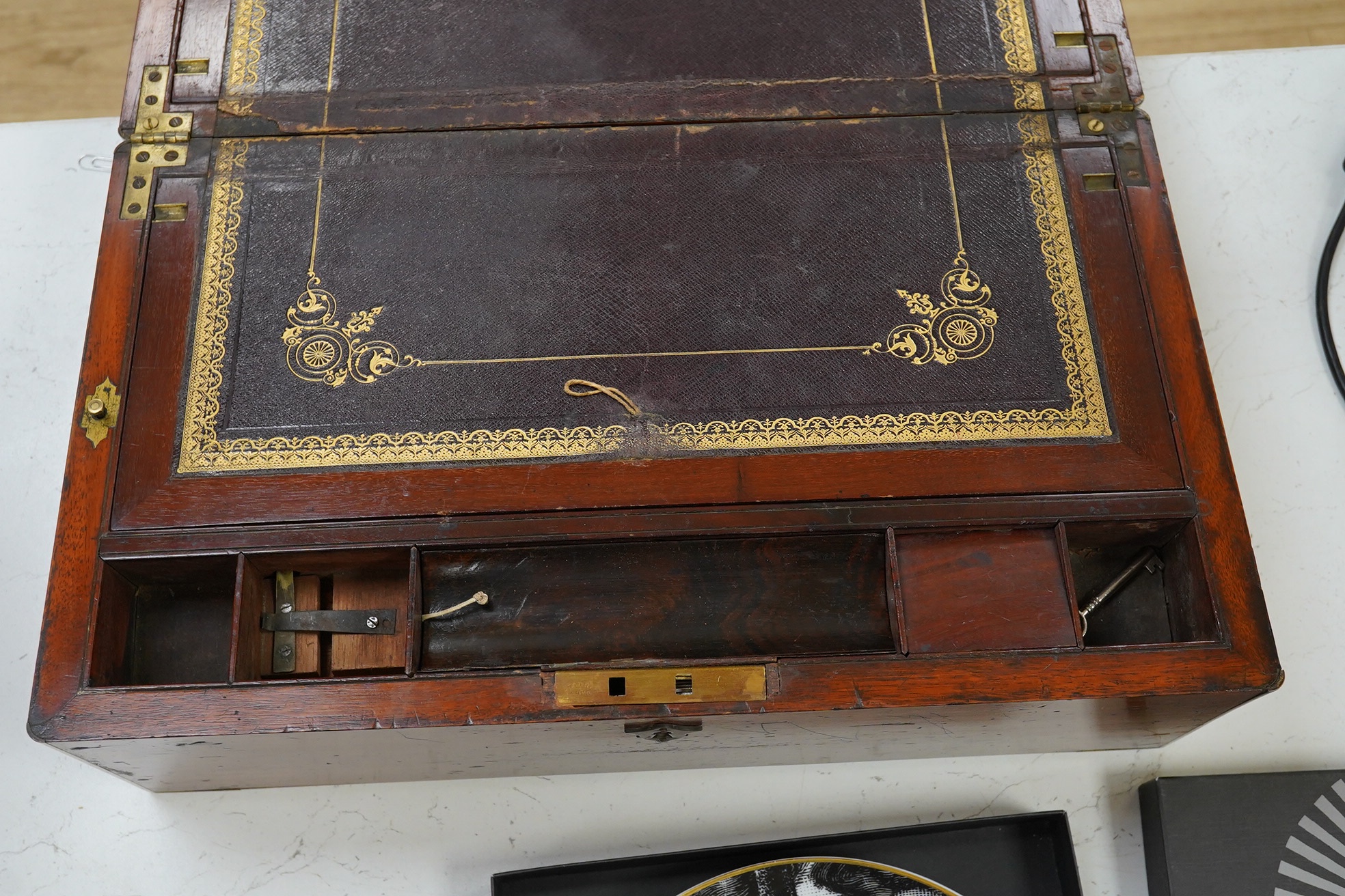 A 19th century mahogany brass bound writing box with tooled leather slope, 45cm wide. Condition - poor